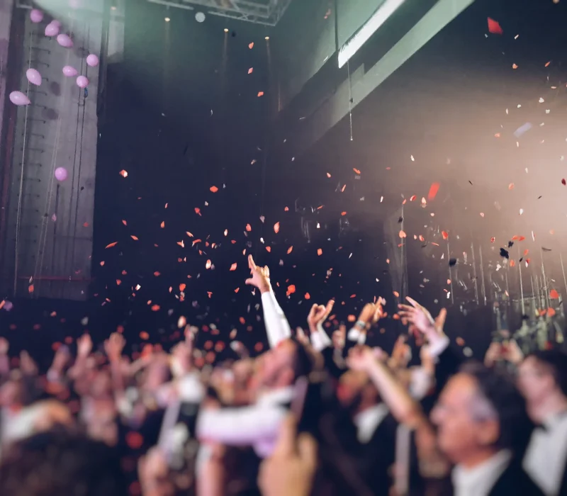 a-crowd-of-people-celebrating-and-dancing-and-havi-2025-03-12-22-08-30-utc